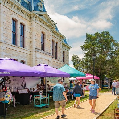 Market tents on the courthouse lawn in Blanco.