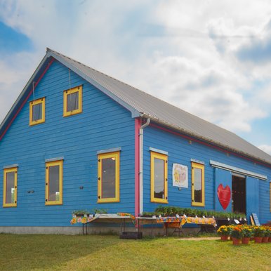 Blue building houses Arnosky Family Farms.