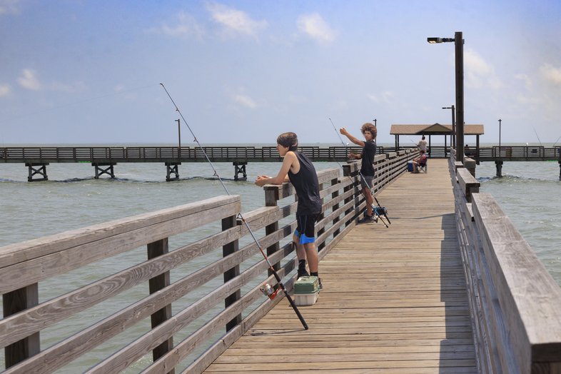 Anglers fish from the Fulton Fishing Pier