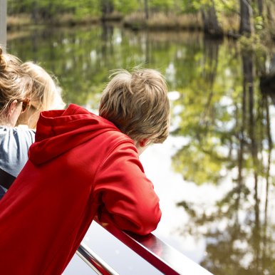 Big Thicket visitors take in the scenery aboard the Ivory Bill boat tour