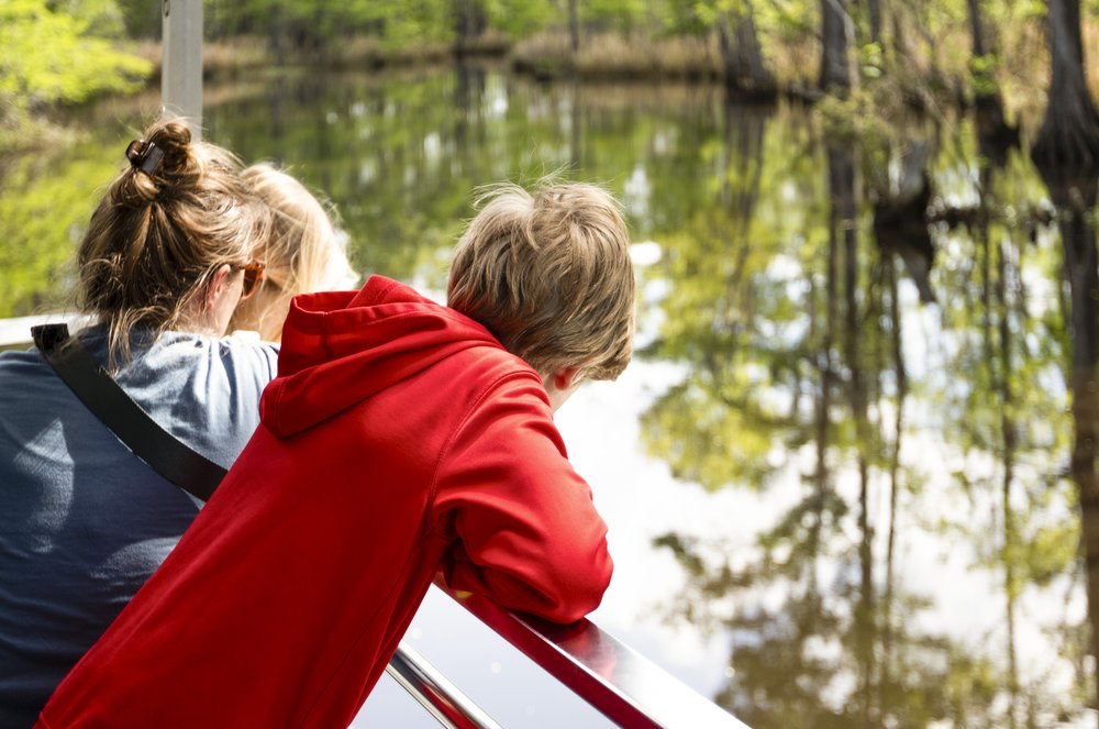 Big Thicket visitors take in the scenery aboard the Ivory Bill boat tour