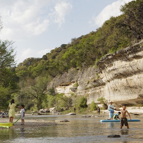 Swimmers, paddlers and anglers enjoy the cliff-lined waters of Guadalupe River State Park