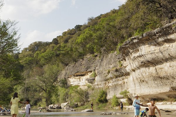 Swimmers, paddlers and anglers enjoy the cliff-lined waters of Guadalupe River State Park