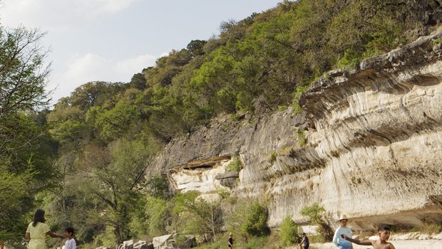 Swimmers, paddlers and anglers enjoy the cliff-lined waters of Guadalupe River State Park