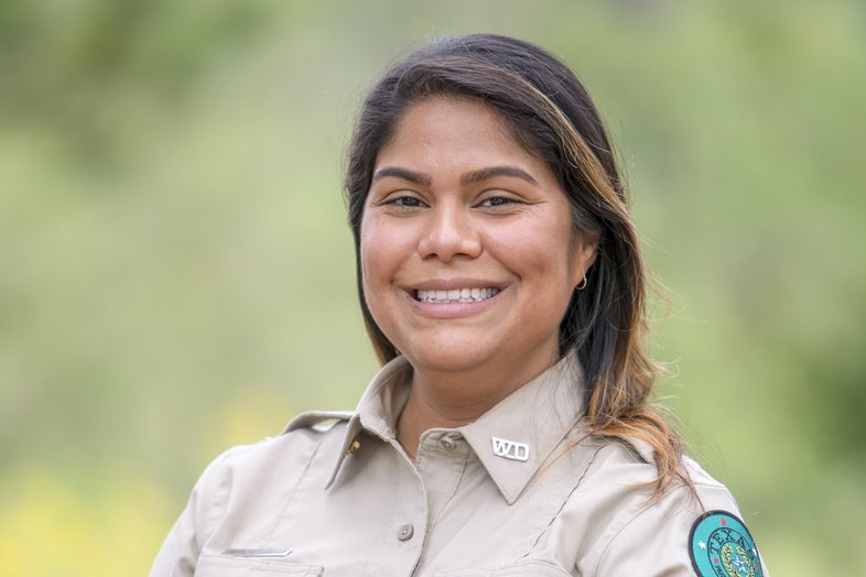 A head and shoulders shot of Ranger Tanguma in her uniform at Guadalupe River State Park