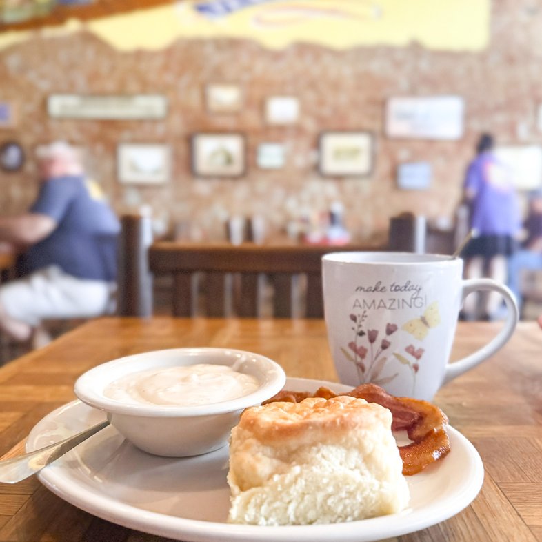 A breakfast plate of biscuits, gravy and a cup of coffee at the Whistle Hills Cafe