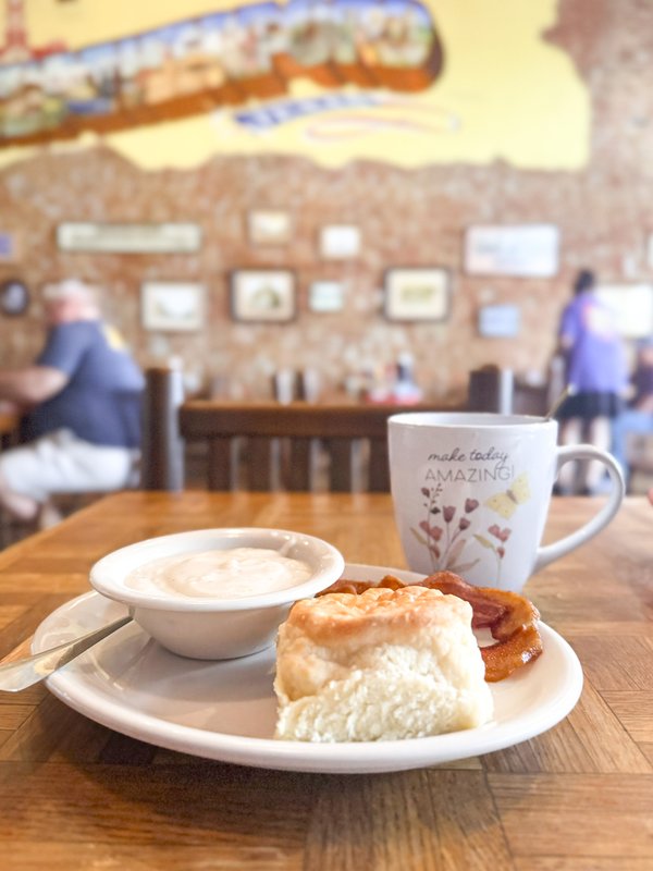 A breakfast plate of biscuits, gravy and a cup of coffee at the Whistle Hills Cafe