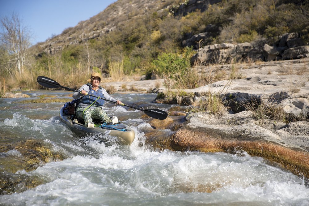 Kayaker navigating rapids on the Devils River