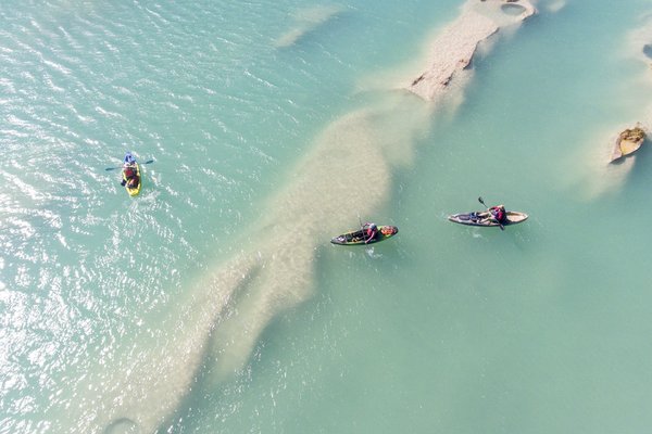Ariel shot of three kayakers on the Devils River