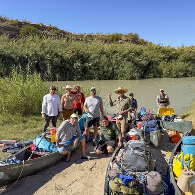Group shot of the paddlers on the banks of the Rio Grande River