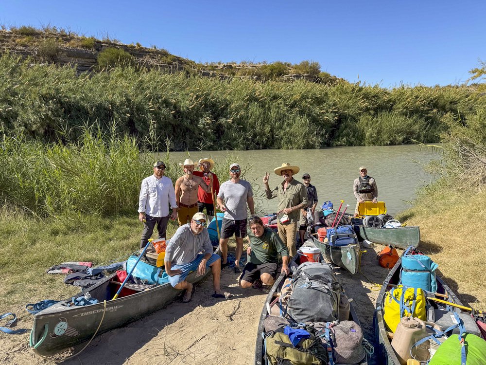 Group shot of the paddlers on the banks of the Rio Grande River