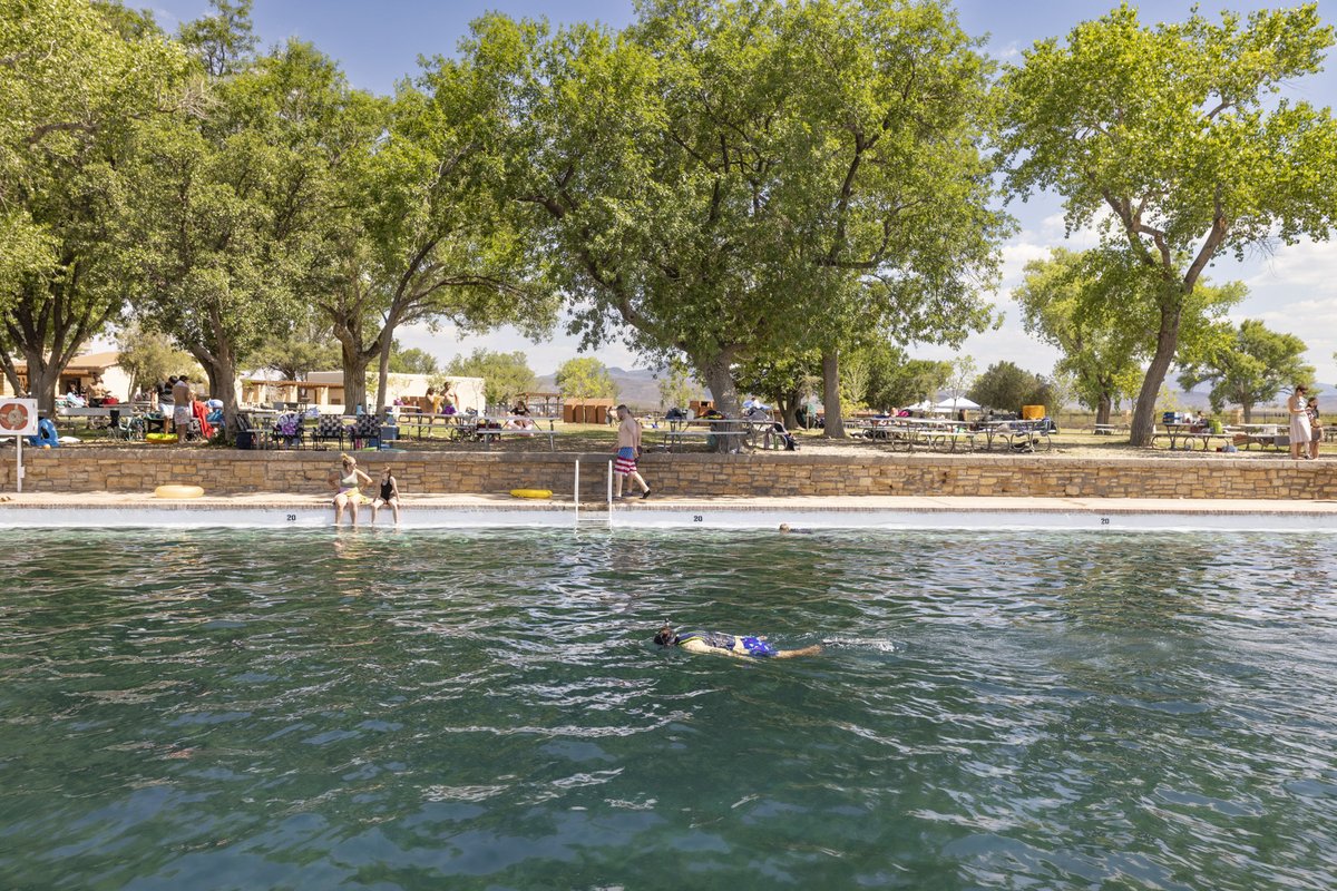 Snorkeler in the spring fed pool at Balmorhea State Park with visitors in the background