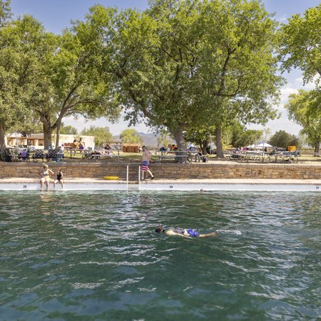 Snorkeler in the spring fed pool at Balmorhea State Park with visitors in the background