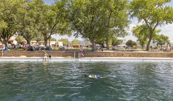 Snorkeler in the spring fed pool at Balmorhea State Park with visitors in the background