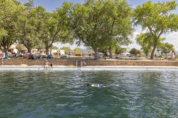Snorkeler in the spring fed pool at Balmorhea State Park with visitors in the background