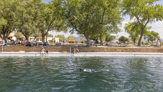 Snorkeler in the spring fed pool at Balmorhea State Park with visitors in the background