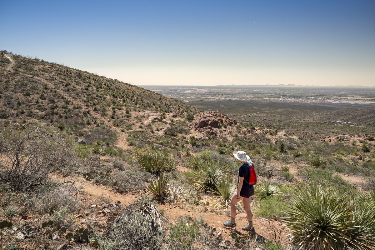 A person hiking through hills.
