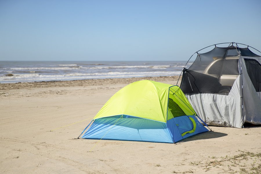 Tents on a beach for camping overnight.