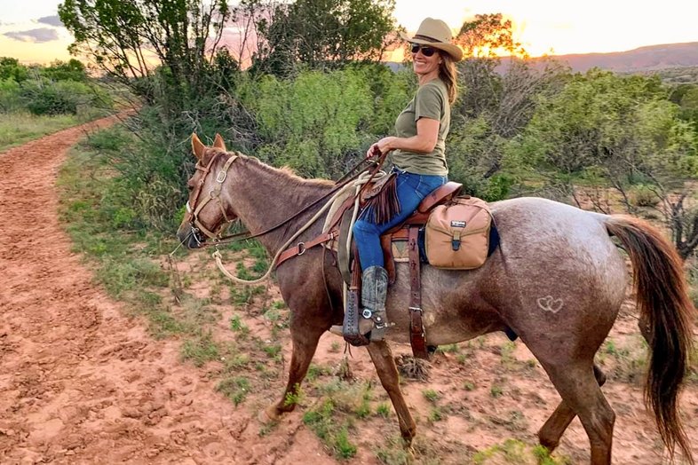 A woman rides her horse at Caprock Canyon State Park