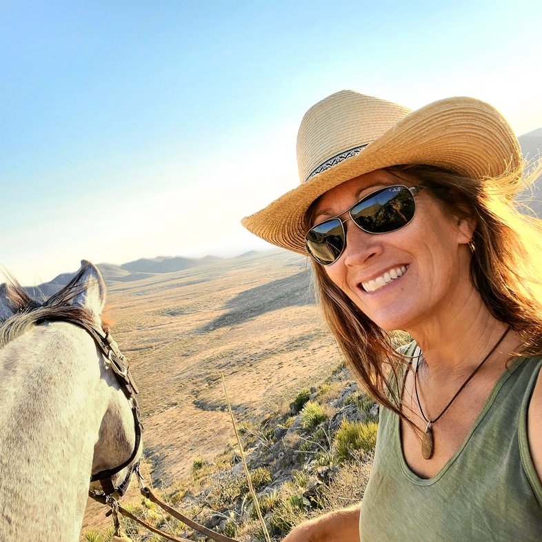 Author Shannon King poses with her horse at Franklin Mountains