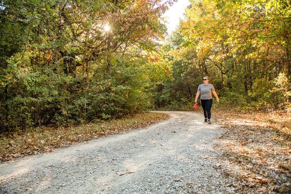 A hiker walks the Bluebird trail at Ray Roberts Lake state park