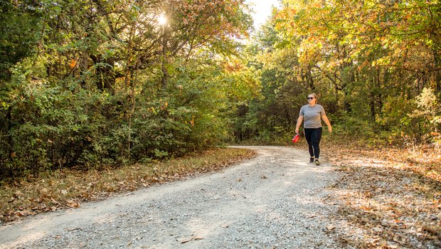 A hiker walks the Bluebird trail at Ray Roberts Lake state park