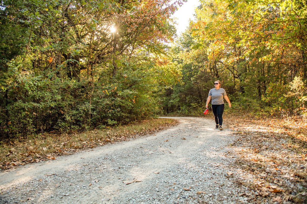 A hiker walks the Bluebird trail at Ray Roberts Lake state park