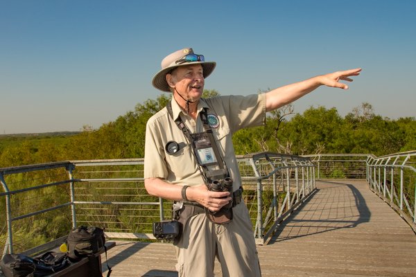 Bentsen-Rio Grande Valley park volunteer John Kaye searches the sky for hawks