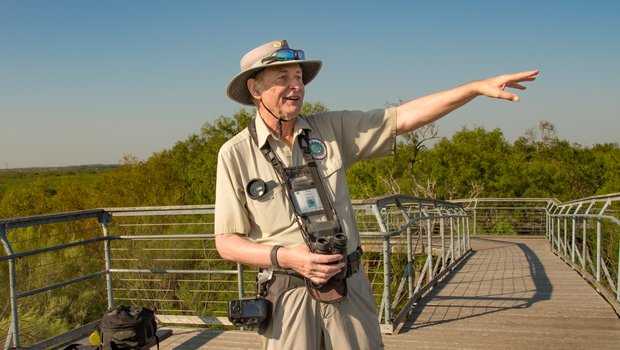 Bentsen-Rio Grande Valley park volunteer John Kaye searches the sky for hawks