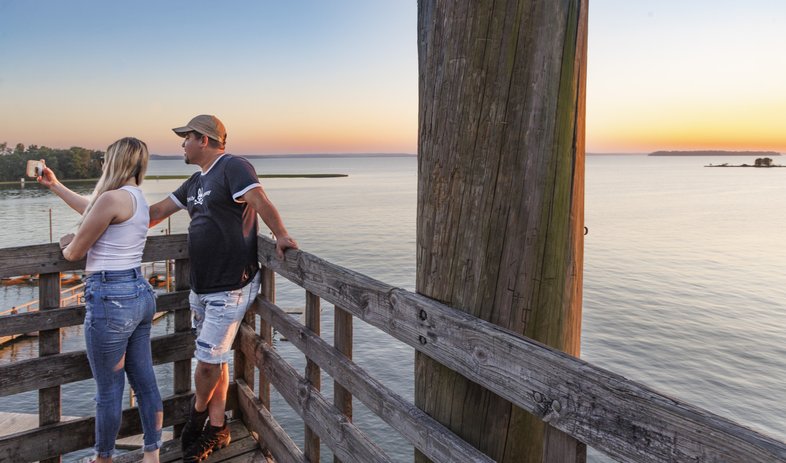 A young couple take a selfie from the lookout tower at Lake Livingston State Park