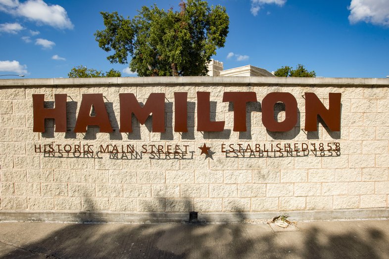 Hamilton sign on large brick wall
