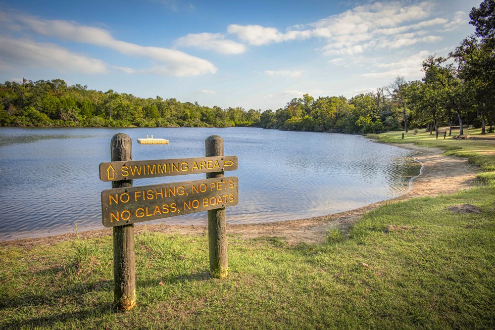 A sign denoting a swimming area with no fishing allowed at Lake Sullivan