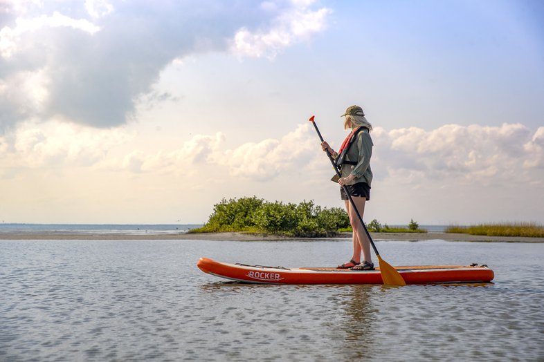 A person on a stand up paddle board on Laguna Madre
