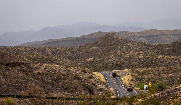 The winding ribbon of River Road follows the bends of the Rio Grande