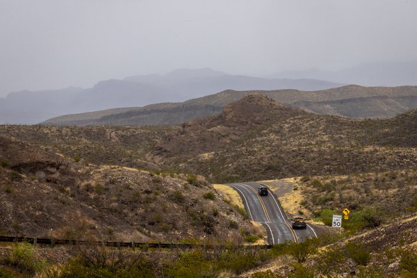 The winding ribbon of River Road follows the bends of the Rio Grande