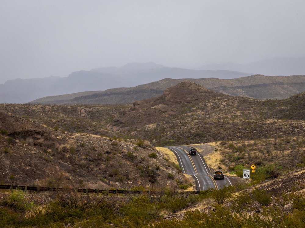 The winding ribbon of River Road follows the bends of the Rio Grande