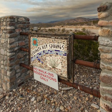 A sign greets visitors to Chinati Hot Springs