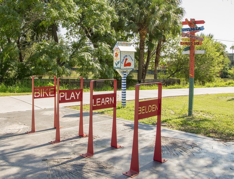 Caracara urban trail with bike stands with labels bike play and learn in Rio Grande Valley.