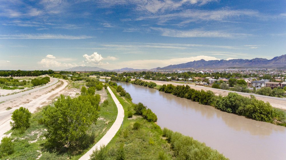 Aerial image of Paso Del Norte trail next to Rio Grande with Franklin Mountains in background