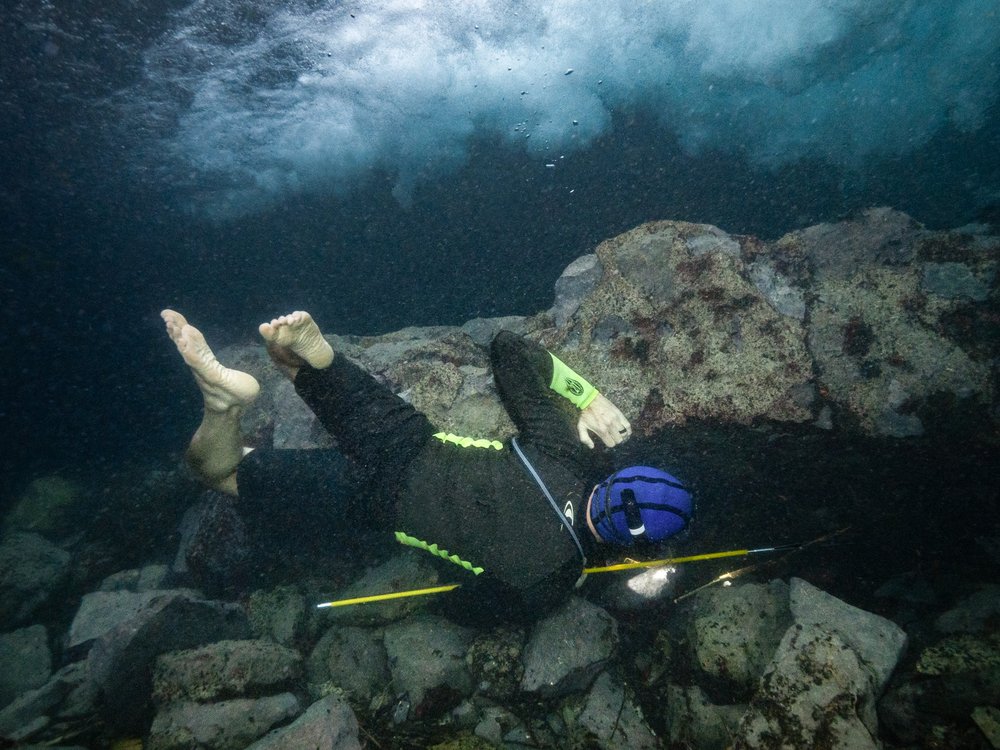 Ryan Gossen Searching for Plecos while spearfishing.
