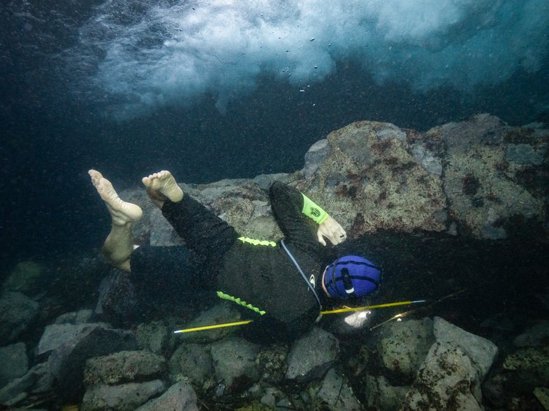 Ryan Gossen Searching for Plecos while spearfishing.