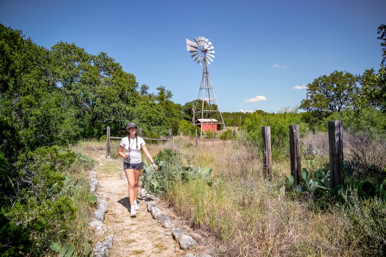 Hiker on the Seargeant Memorial Trail in Kickapoo Caverns State Park.