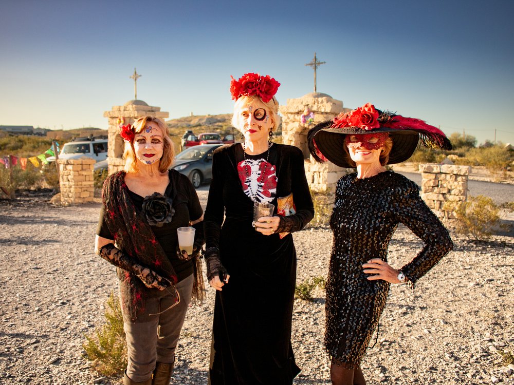 People in costumes for the Dia de los Muertos celebration in Terlingua Cemetery.