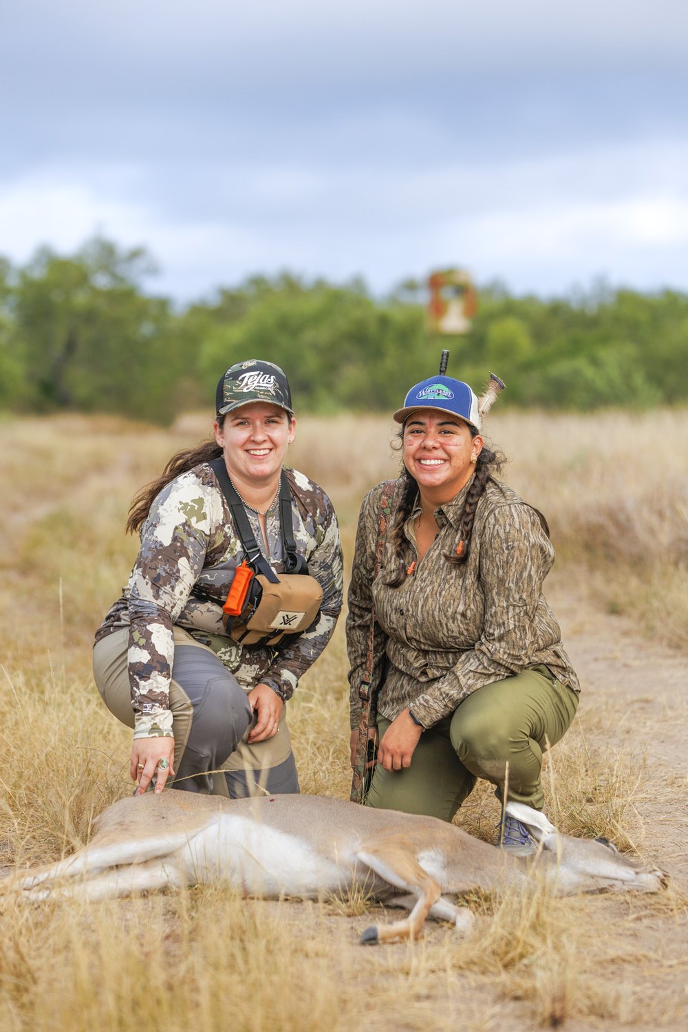 Meagan McElya and Ittzel Rodriguez pose above Rodriguez's first deer