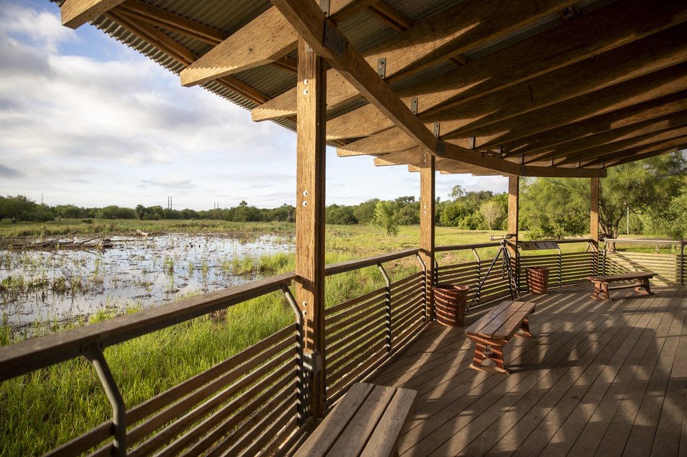 View of the covered wooden headquarters deck at Estero Llano Grande state park