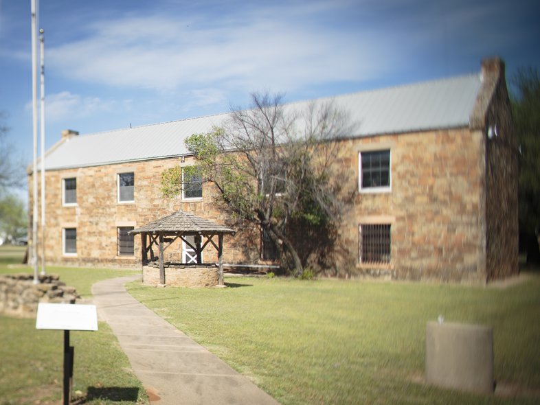A stone two story building at Fort Belknap.