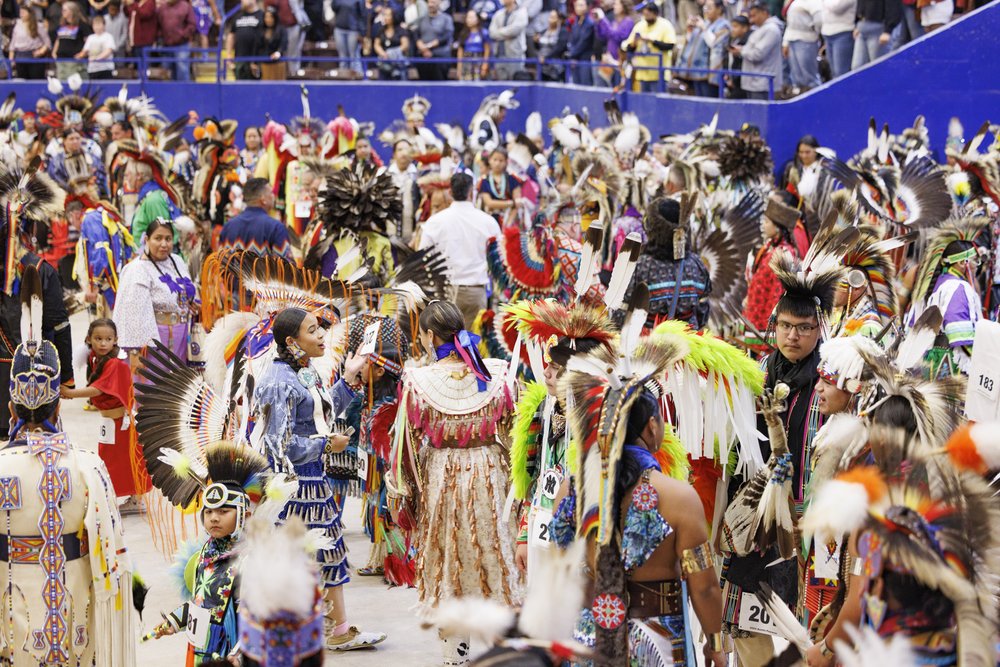 People in Native American attire at the annual Powwow at the Austin Convention Center.