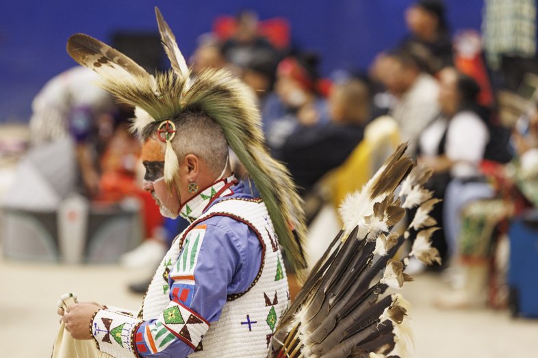 Man wearing Native American clothing at the annual Powwow at the Austin Convention Center.