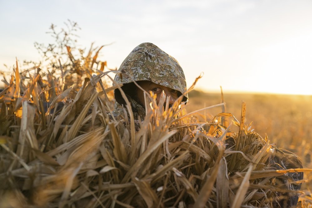 The author, disguised in camouflage, on the hunt for sandhill crane.