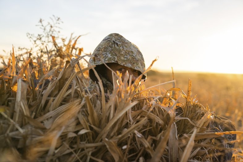 The author, disguised in camouflage, on the hunt for sandhill crane.